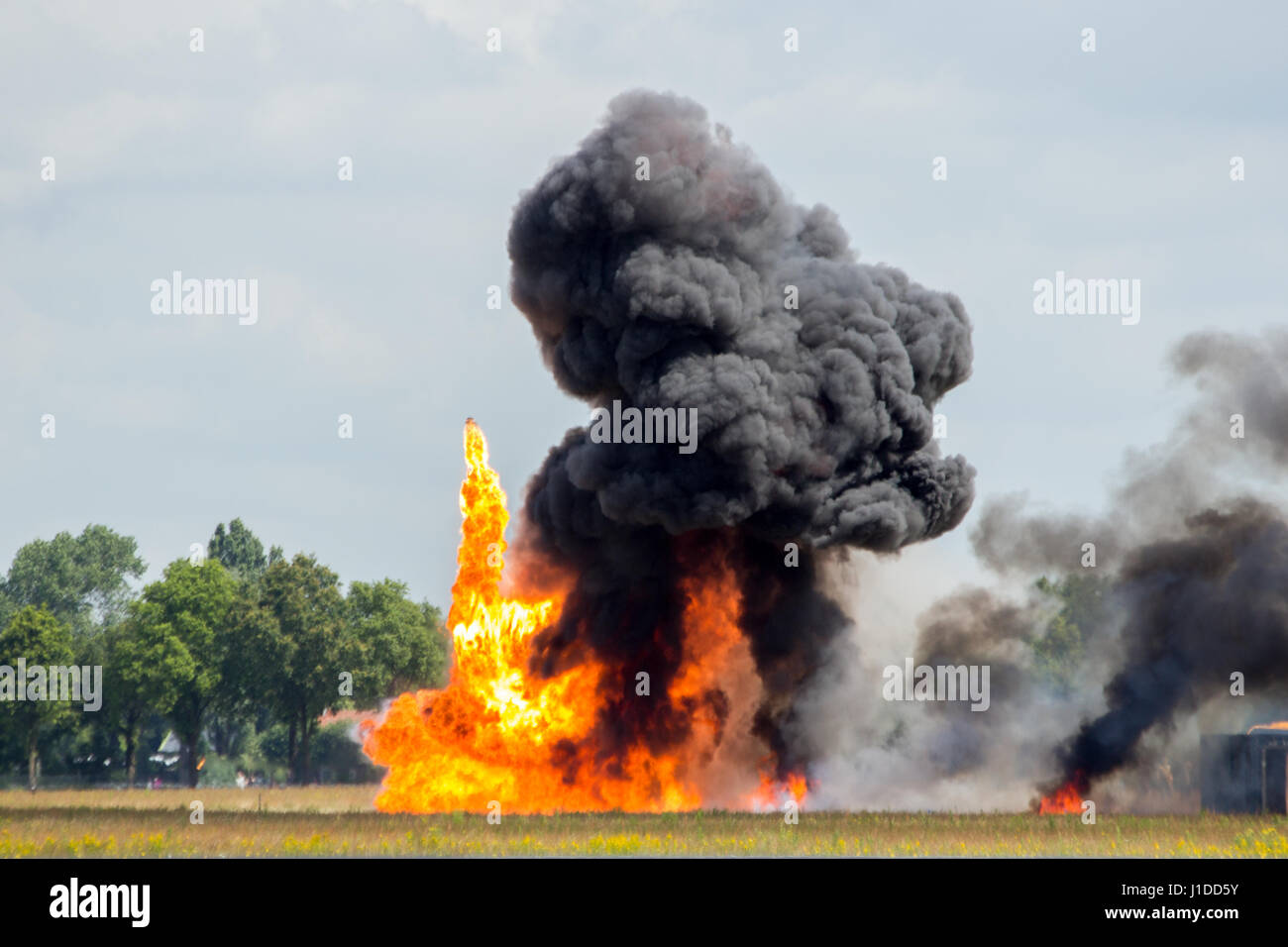 Large explosion with black smoke Stock Photo