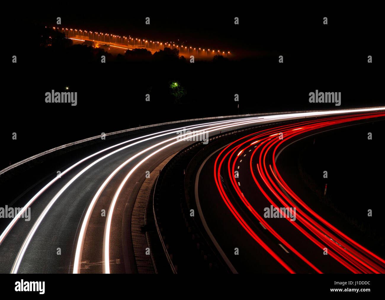 Highway with car lights trails at night. Poland, Swietokrzyskie. Stock Photo