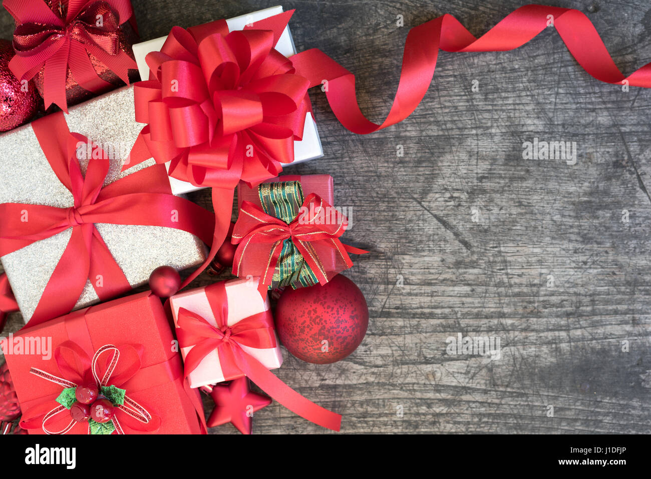 Christmas background decorations with gift boxes and red ribbon bow on ...