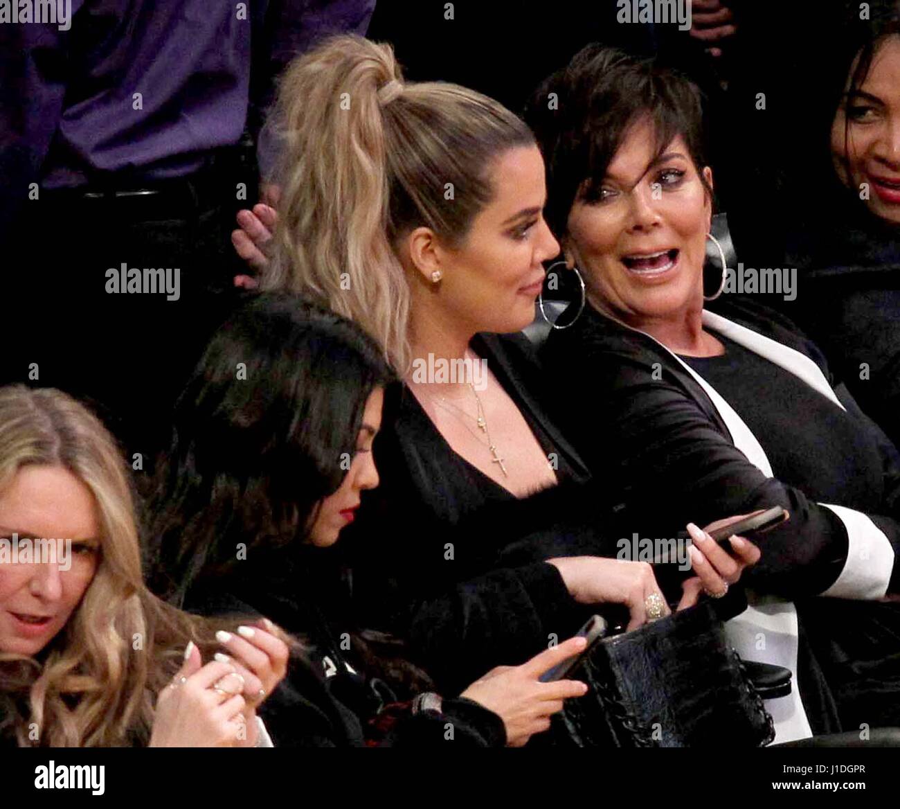 Khloe Kardashian, Kourtney Kardashian and Kris Jenner watching the Los