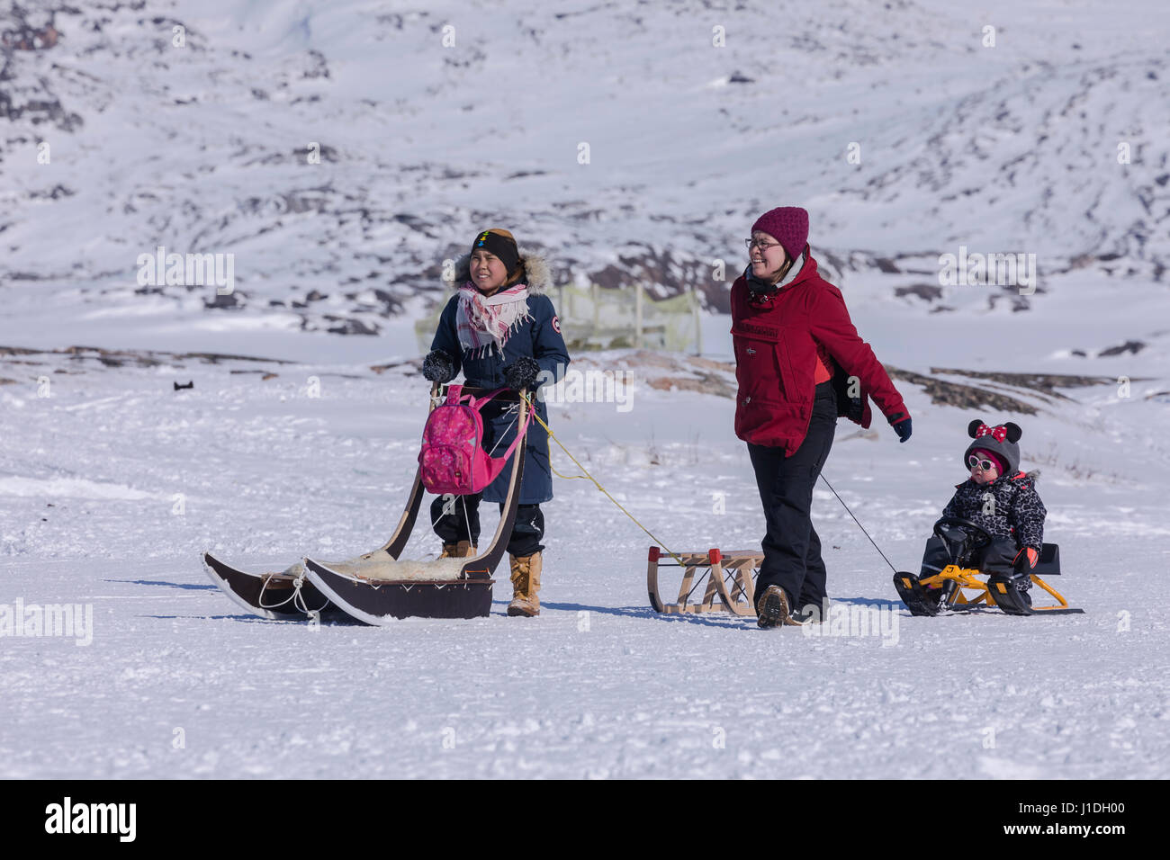 Inuit family in Ilulissat, Greenland Stock Photo