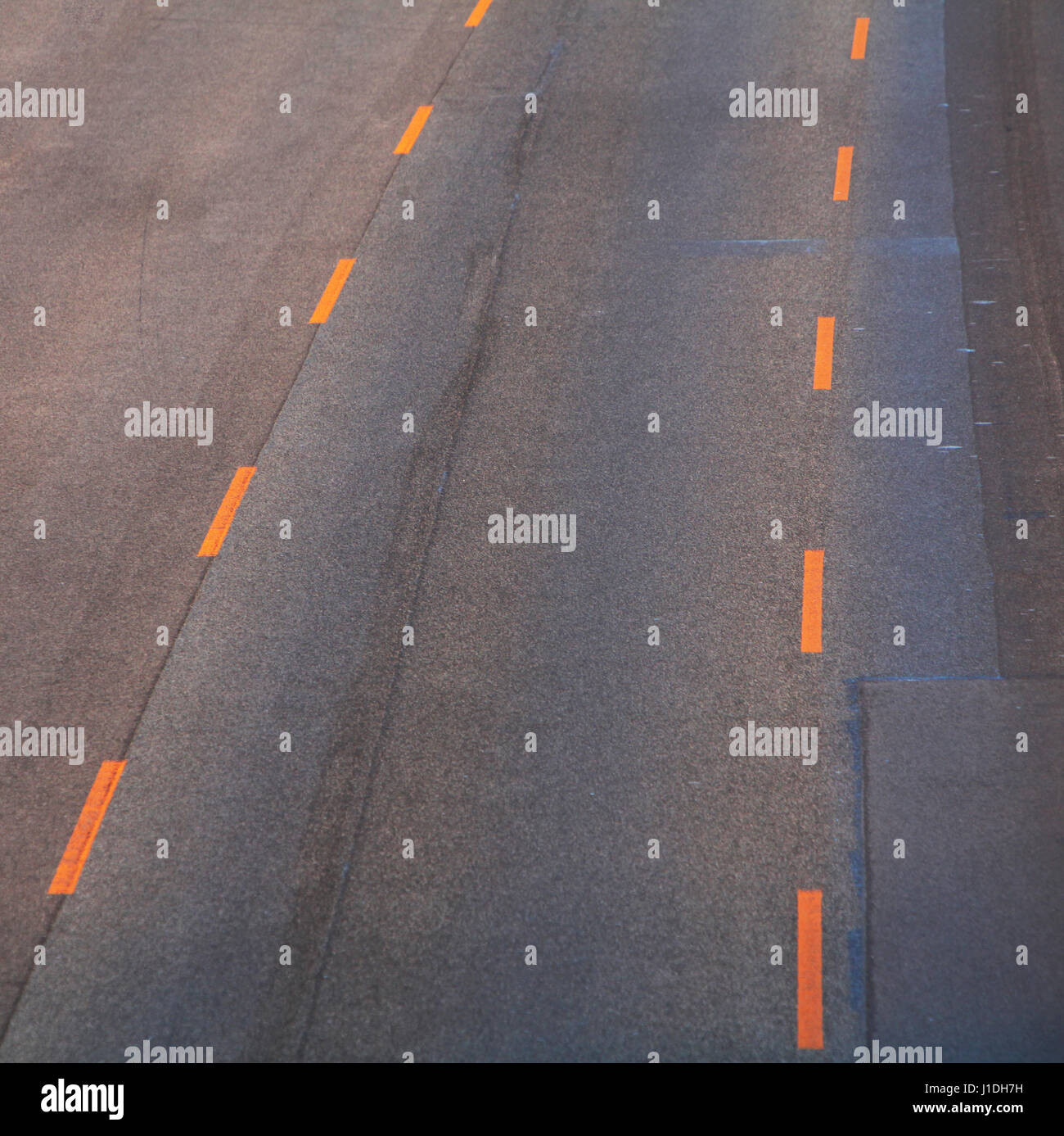 Road with orange lines Stock Photo