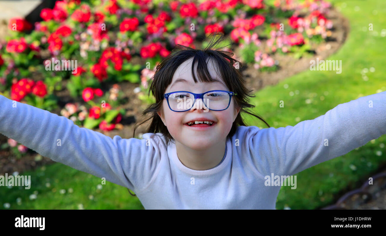 Portrait of little girl smiling outside Stock Photo - Alamy