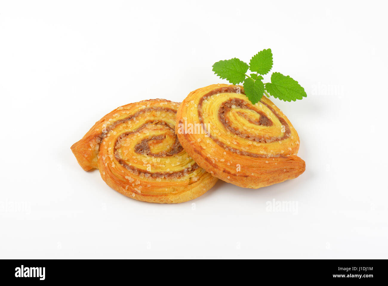 sweet cinnamon rolls on white background Stock Photo - Alamy