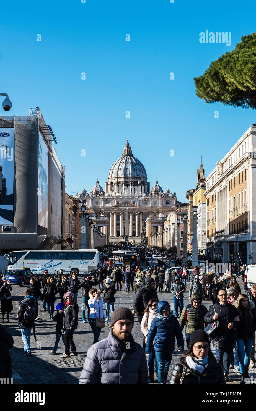 Rome, Italy - January 5, 2017: Street full of tourists with the dome of the Vatican in the background in Rome, Italy Stock Photo