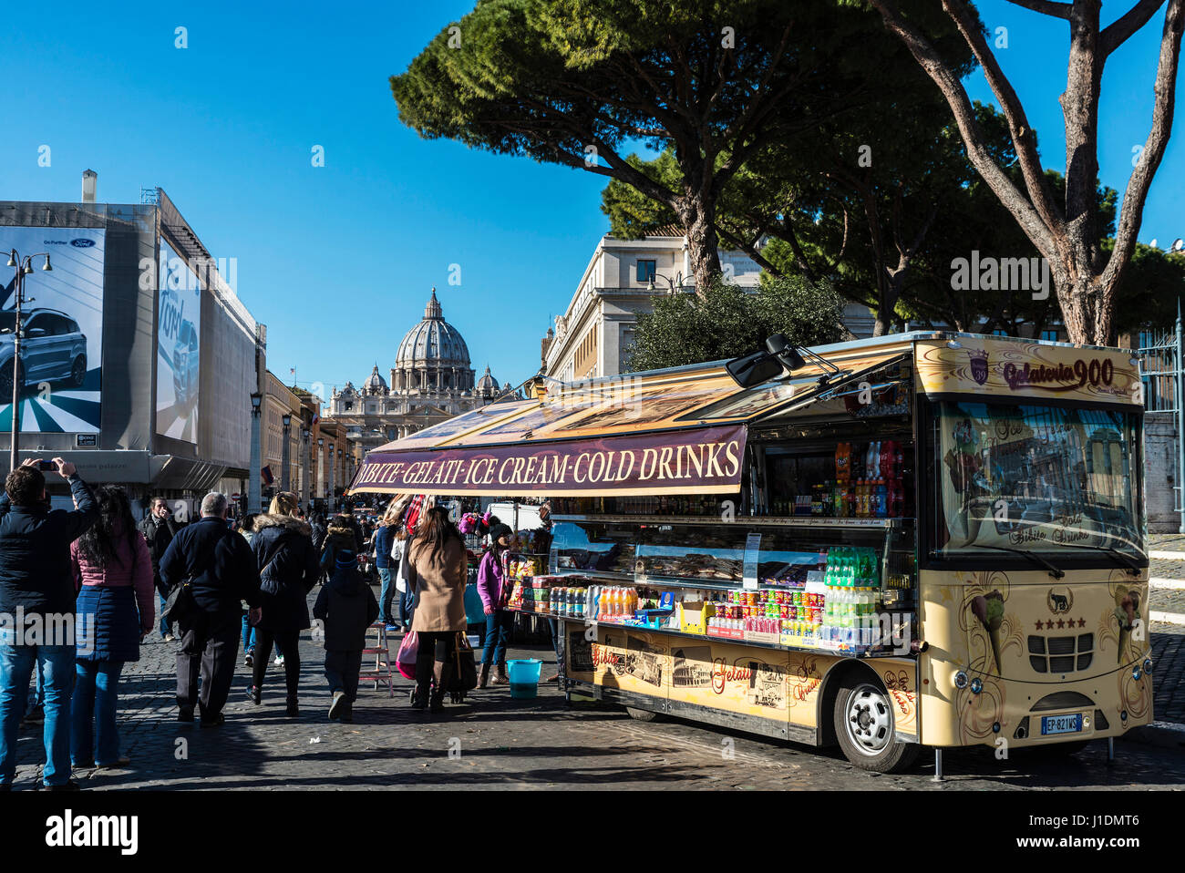 Rome, Italy - January 5, 2017: Food truck on a street full of tourists with the dome of the Vatican in the background in Rome, Italy Stock Photo