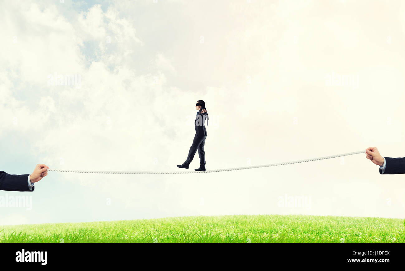 Business concept of risk support and assistance with man balancing on ...