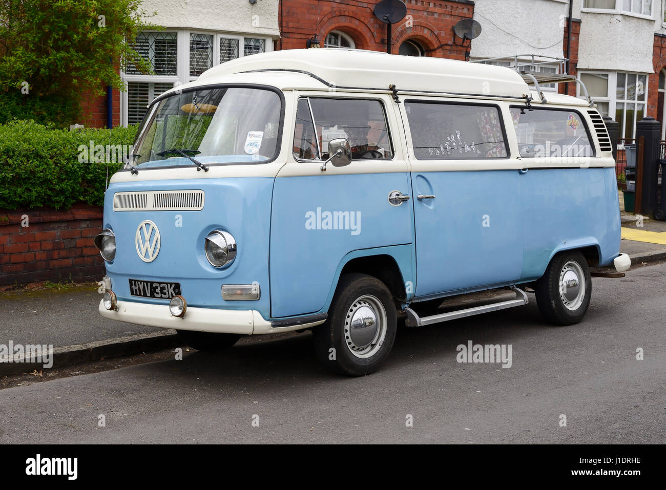 A vintage VW camper van from the year 1971 parked on a suburban street in Chester UK Stock Photo