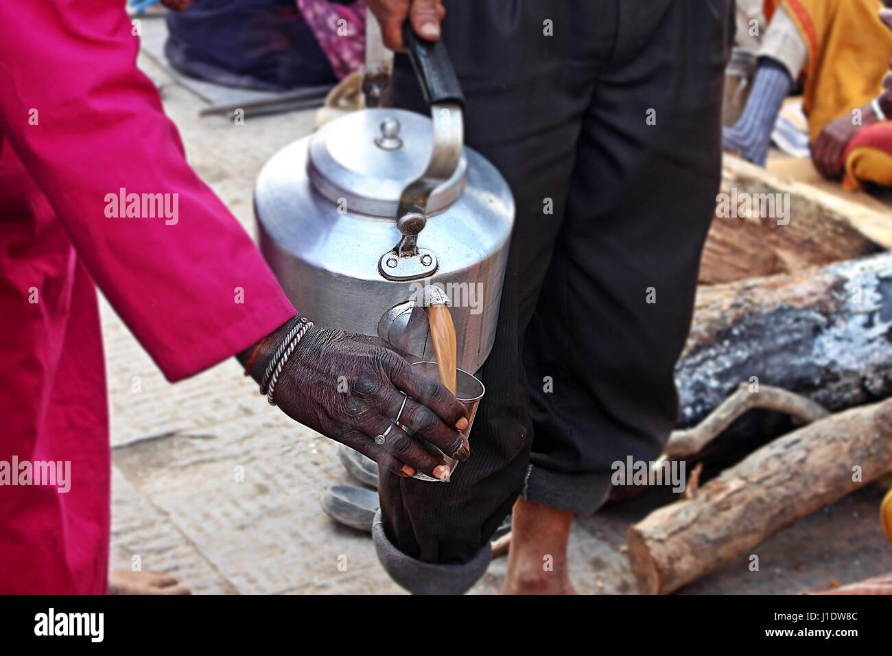 Sadhu Taking a Cup of Tea. Stock Photo