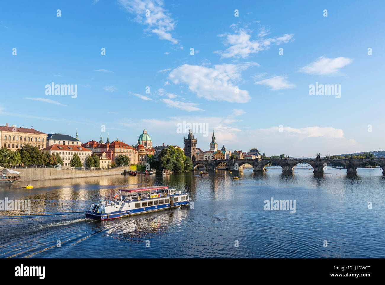 Prague. Cruise boat on the Vltava river looking towards the Charles Bridge, Prague, Czech Republic Stock Photo