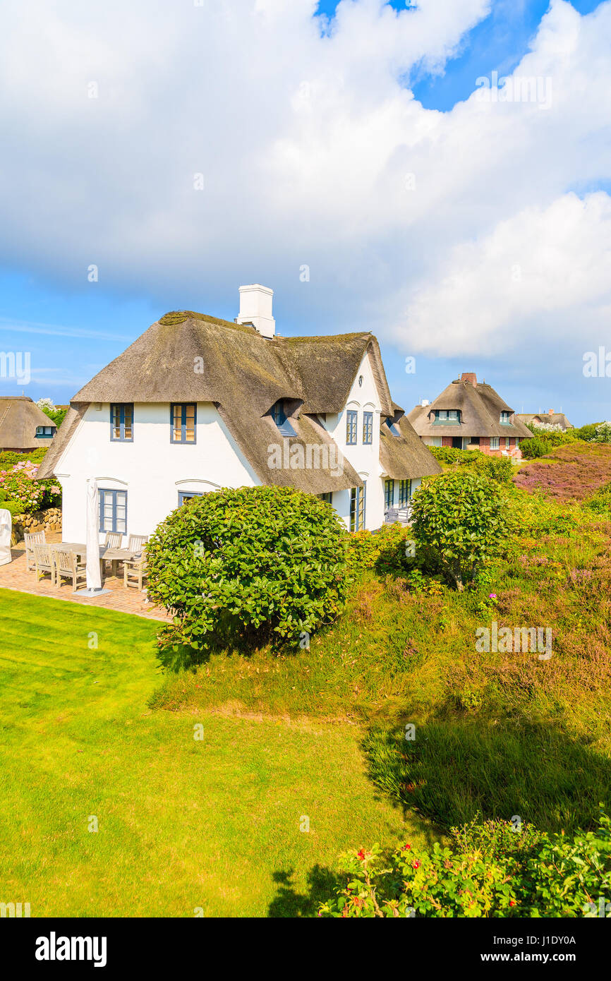 Typical Frisian houses with thatched roof on Sylt island in Westerheide village, Germany Stock Photo