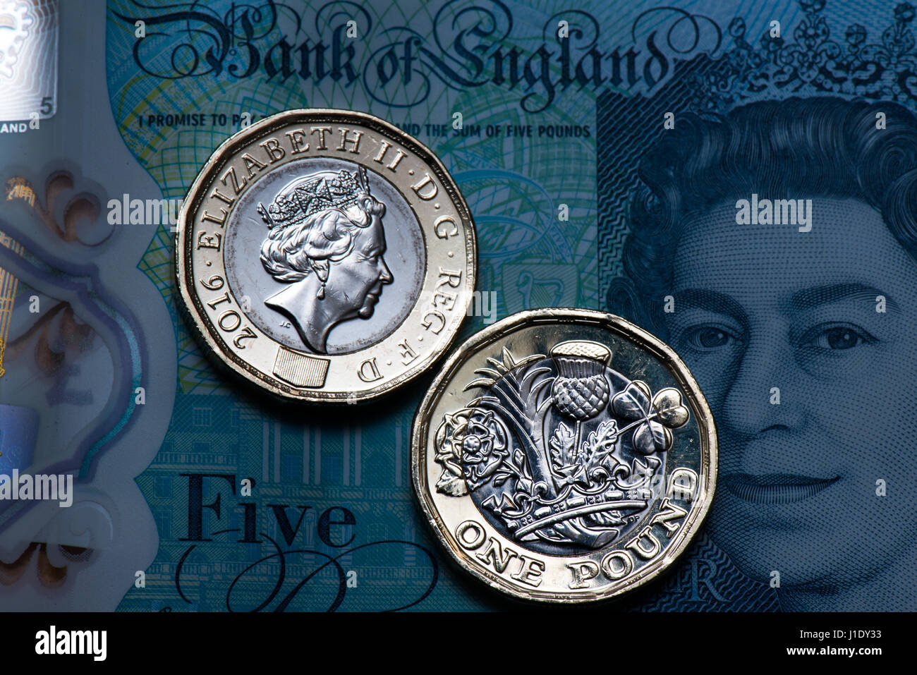 New one pound coins on a new £5 note. The new 12-sided coin entered ...