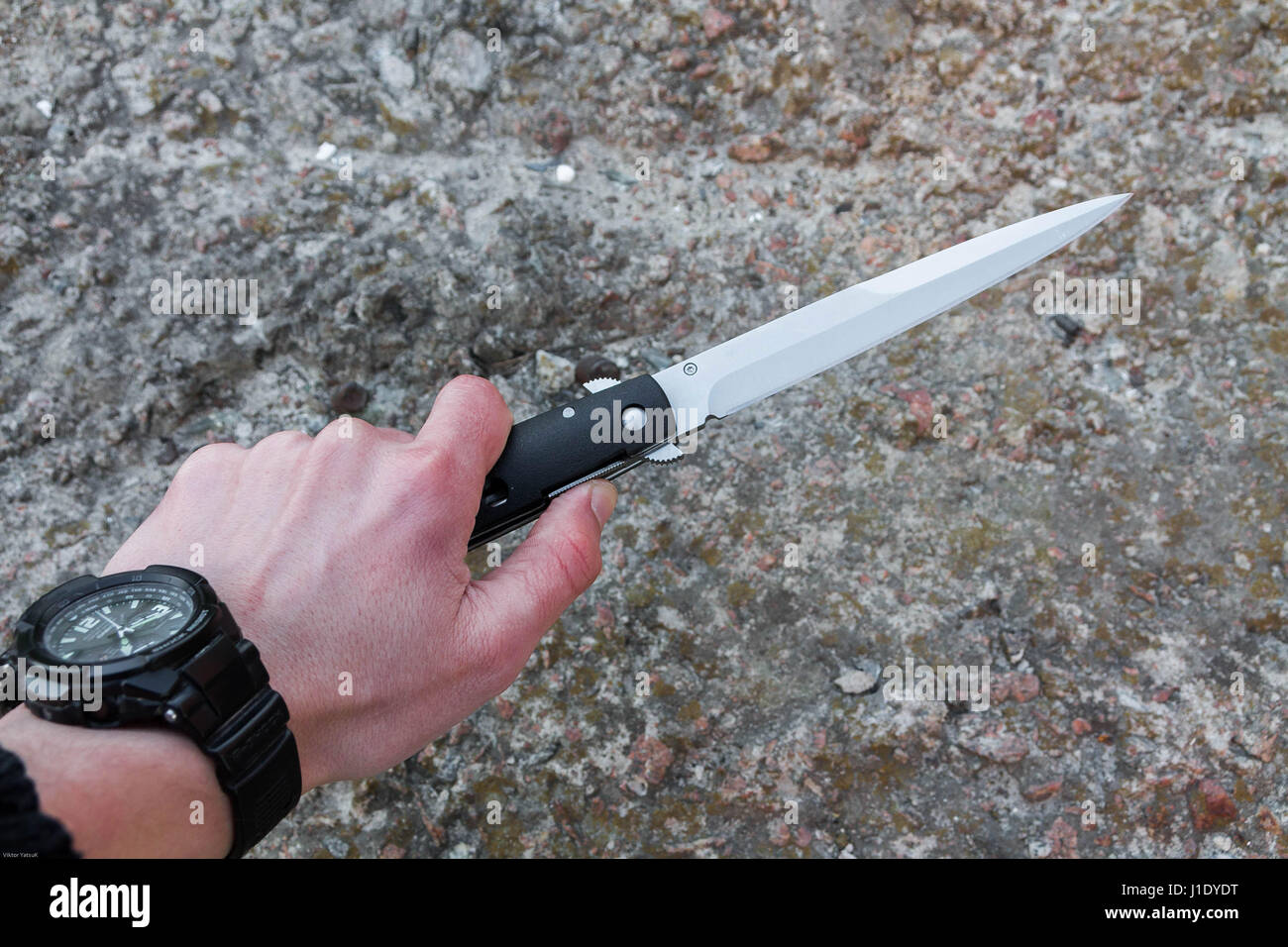 The knife in his left hand. Knife fight Stock Photo Alamy