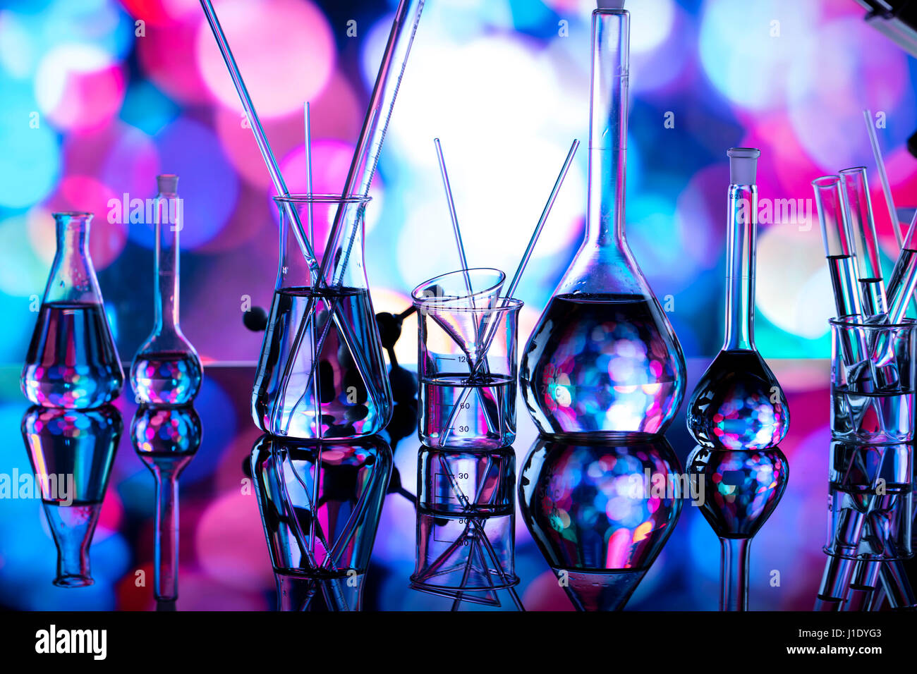 Modern laboratory equipment , set of different glassware on blue ...