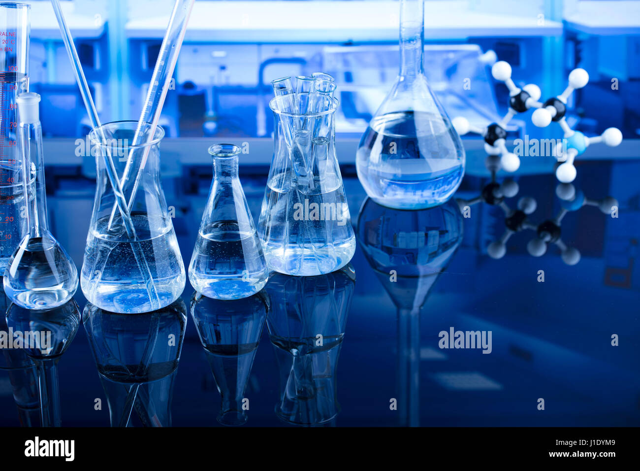Hot Objects Science Lab Modern laboratory equipment , set of different glassware on blue ...
