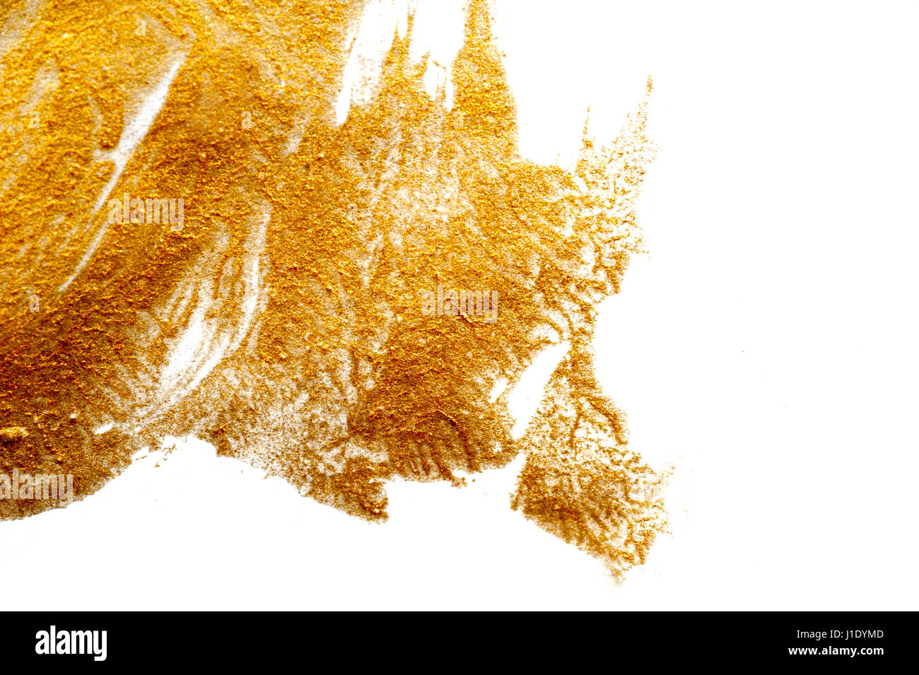 Abstract background painted with a brush of gold paint Stock Photo