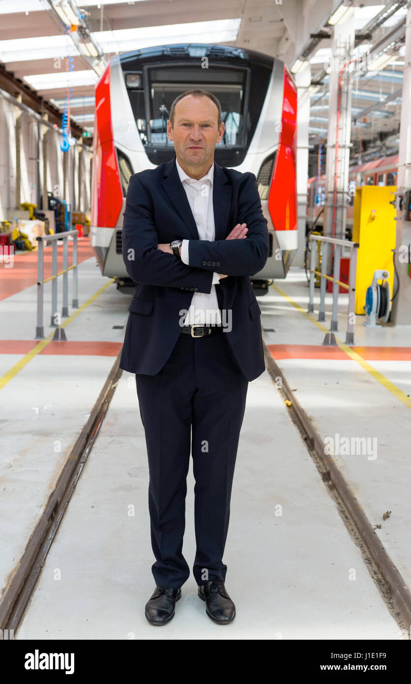 Hamburg, Germany. 20th Apr, 2017. Dieter Bleich, CFO and head of human resources of S-Bahn Hamburg poses in front of the new ET490 city train, which will be used starting from autumn 2017, at a factory hall of the S-Bahn depot in Hamburg, Germany, 20 April 2017. Photo: Christophe Gateau/dpa/Alamy Live News Stock Photo