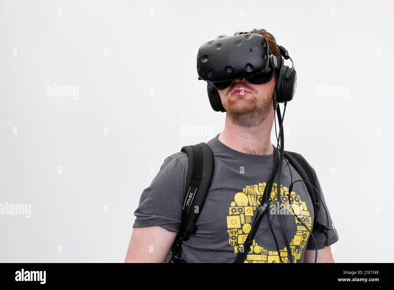 London, UK.  20 April 2017.  A user experiences the latest advancements in military virtual reality at the Virtual Reality Show which opened today at the Business Design Centre in Islington. The user wears a backpack containing a computer allowing an untethered and mobile experience.  Credit: Stephen Chung / Alamy Live News Stock Photo