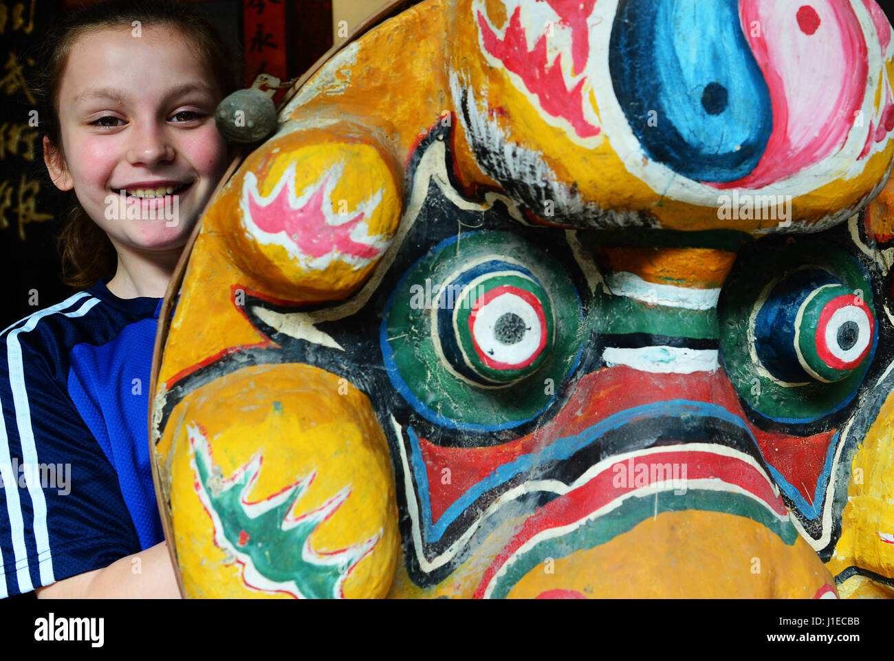 (170421) -- YONGCHUN, April 21, 2017 (Xinhua) -- Niewerth Luise learns about the lion dance at Wenggongci martial art club in Yongchun, southeast China's Fujian Province, April 20, 2017. Influenced by the movie Kung Fu Panda, eleven-year-old German girl Niewerth Luise started to learn Kung Fu from her father since 2015. She was attracted by the White Crane Style, a Chinese martial art originated in Yongchun of China's Fujian Province, which was practiced by actor Bruce Lee. In April 2017, Niewerth came with her family and serval German Kung Fu fans to Yongchun to learn the White Crane Style.   Stock Photo