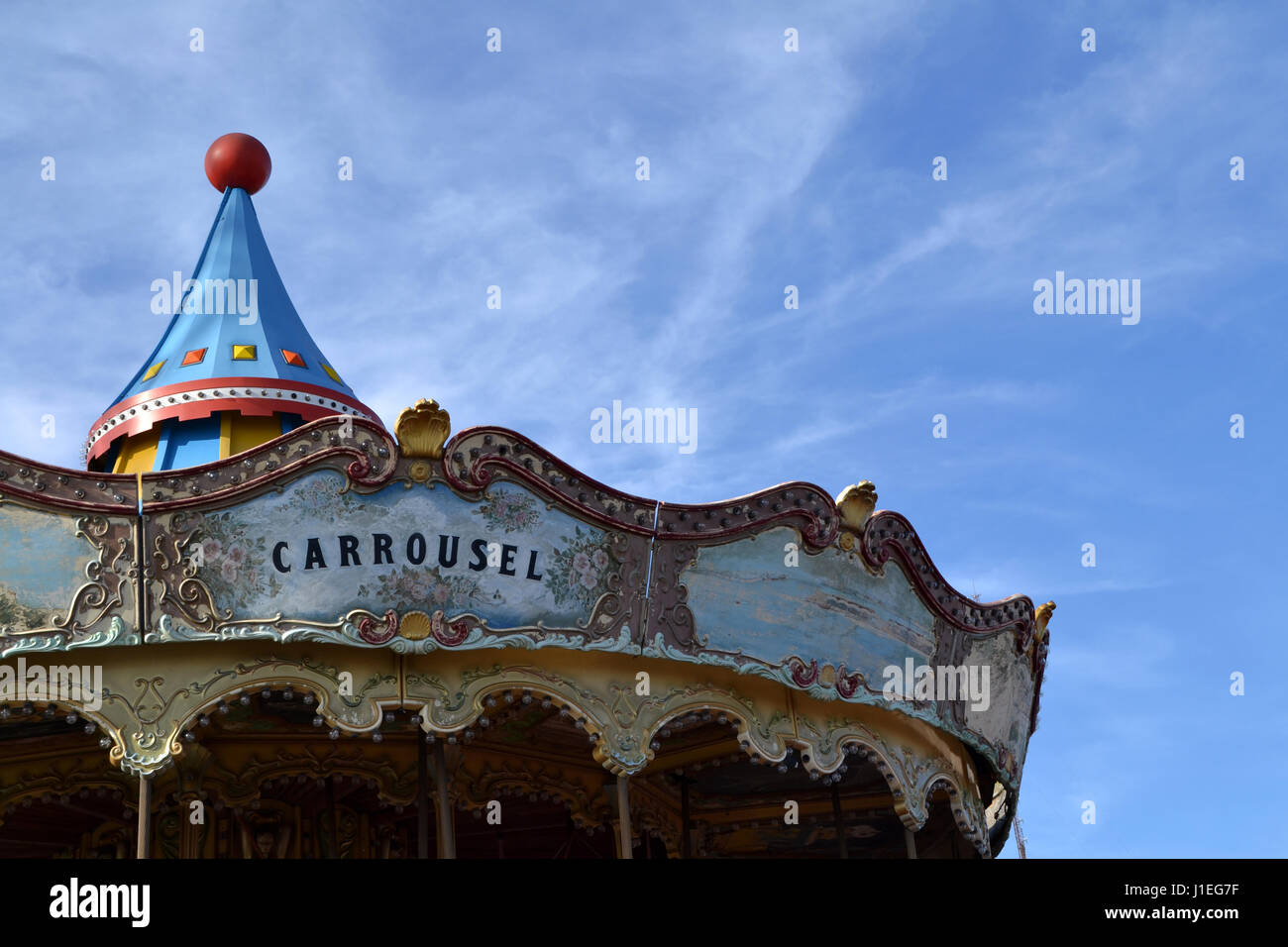 Closeup of a old carousel on a blue sky Stock Photo