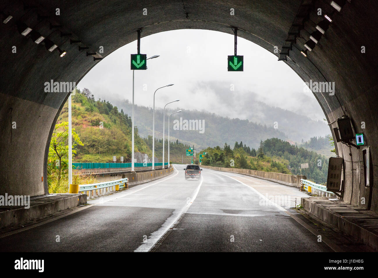 Guizhou, China.  Modern Highway in Guizhou Province, Exiting Tunnel. Stock Photo