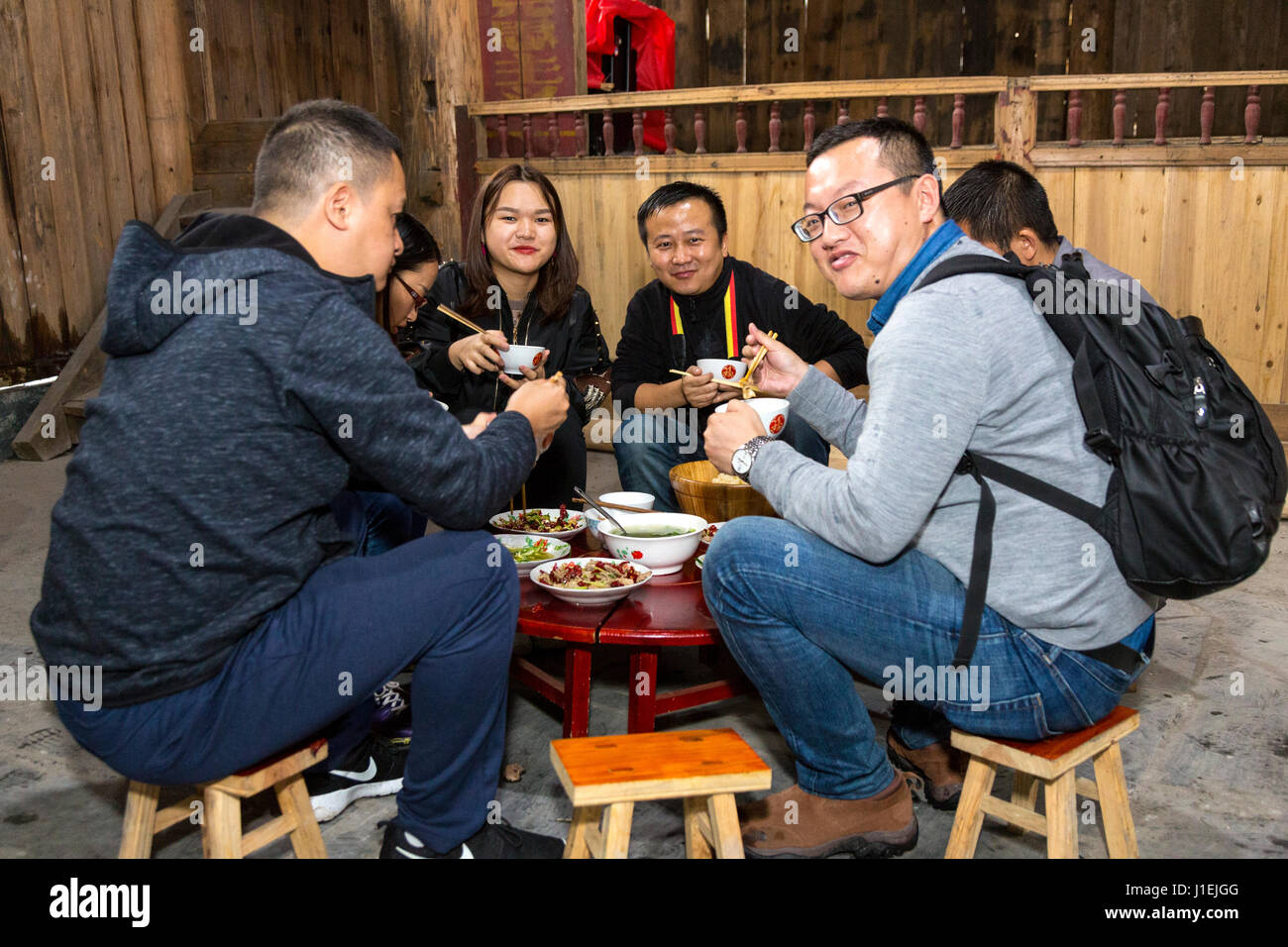 Huanggang, Guizhou, China.  Tour Guides Eating Lunch. Stock Photo