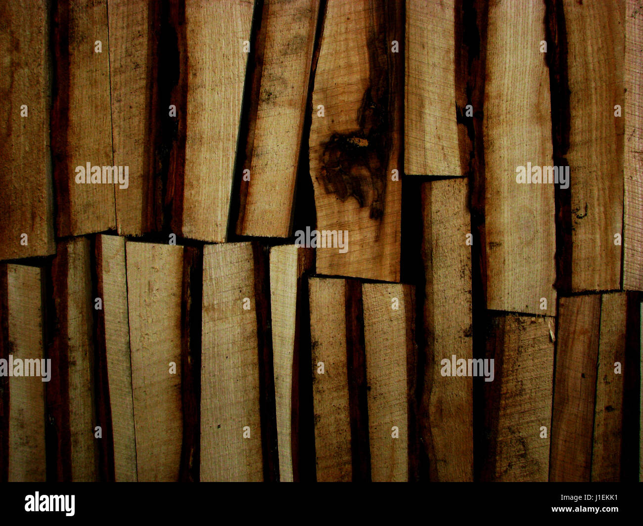 Firewood stacked in several rows Stock Photo
