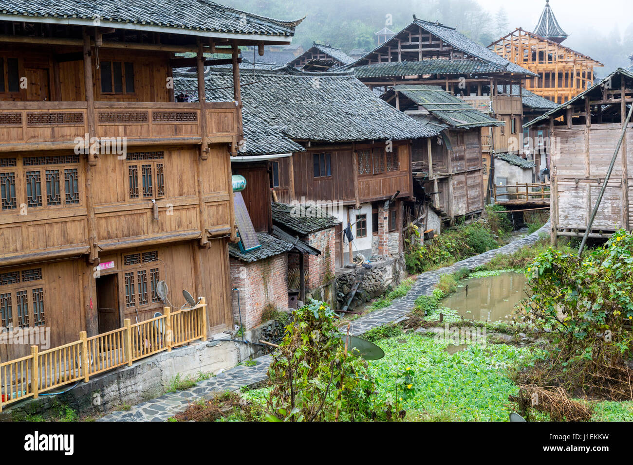 Huanggang, Guizhou, China.  A Dong Ethnic Village, Typical Houses.  Satellite Dish, lower left. Stock Photo
