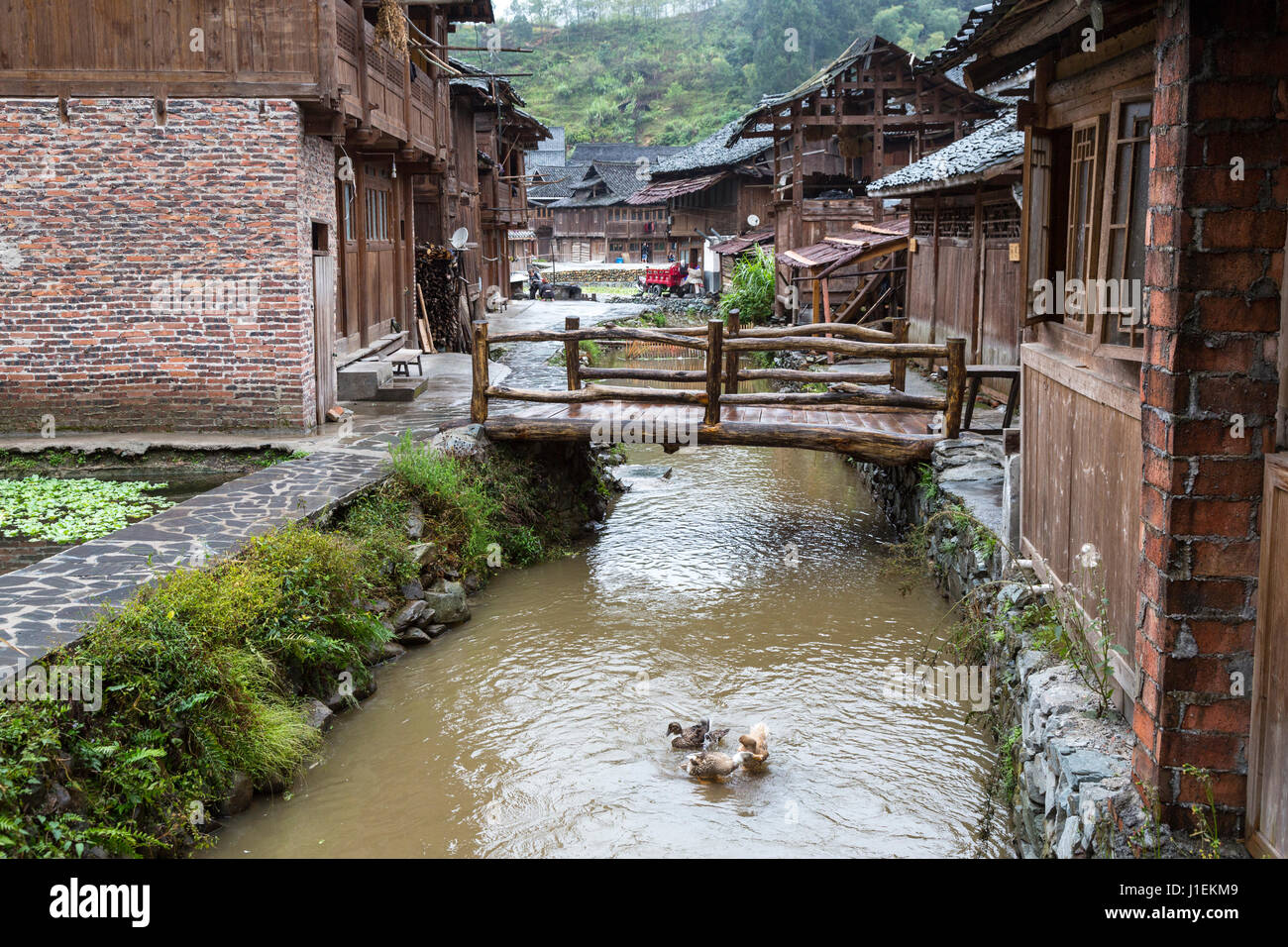 Huanggang, Guizhou, China.  A Dong Ethnic Village, Typical Houses.  Two Satellite Dishes noticeable.. Stock Photo