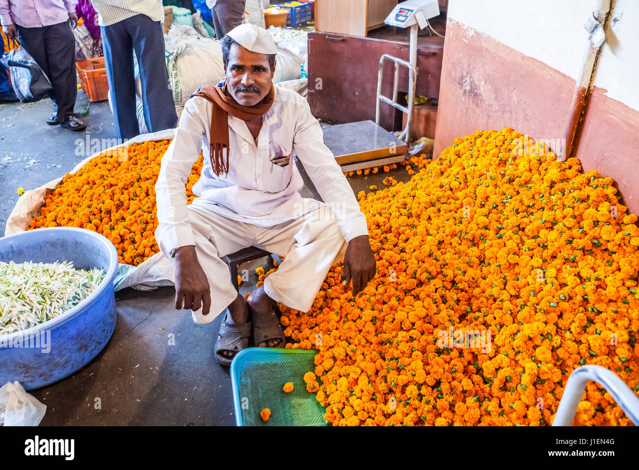 Portrait of a man working in a flower market, Pune, India. Stock Photo