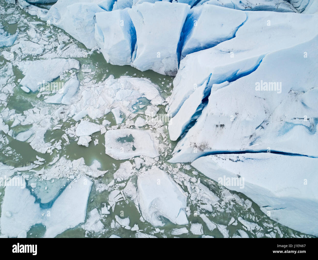 The Mendenhall glacier in Southeast Alaska as seen from above melting into the lake. Stock Photo