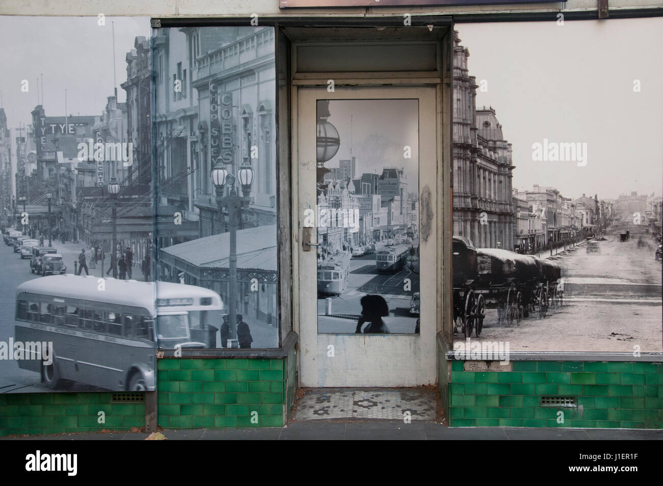 Period photography masking the facade of a city centre building offered for sale in Melbourne, Australia Stock Photo