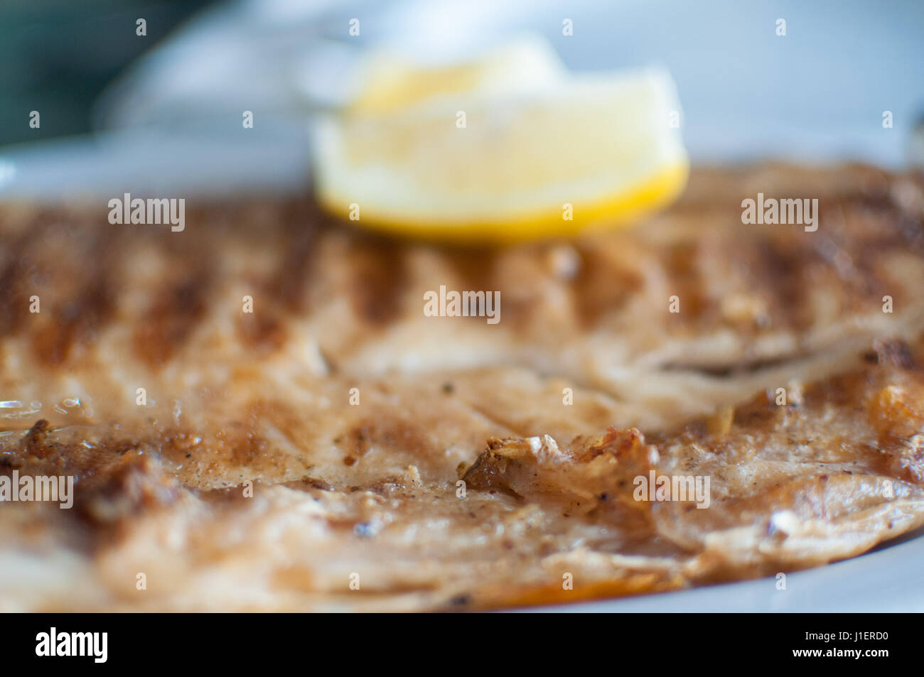 Grilled fish fillet on barbecue with lemon - Boga (Leporinus obtusidens) Stock Photo