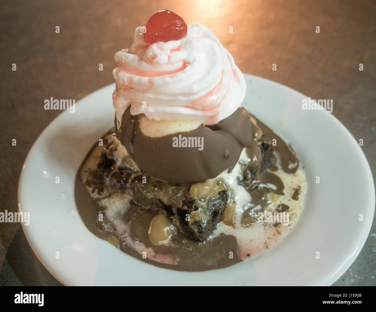 Brownie with ice cream and cherry on top Stock Photo - Alamy