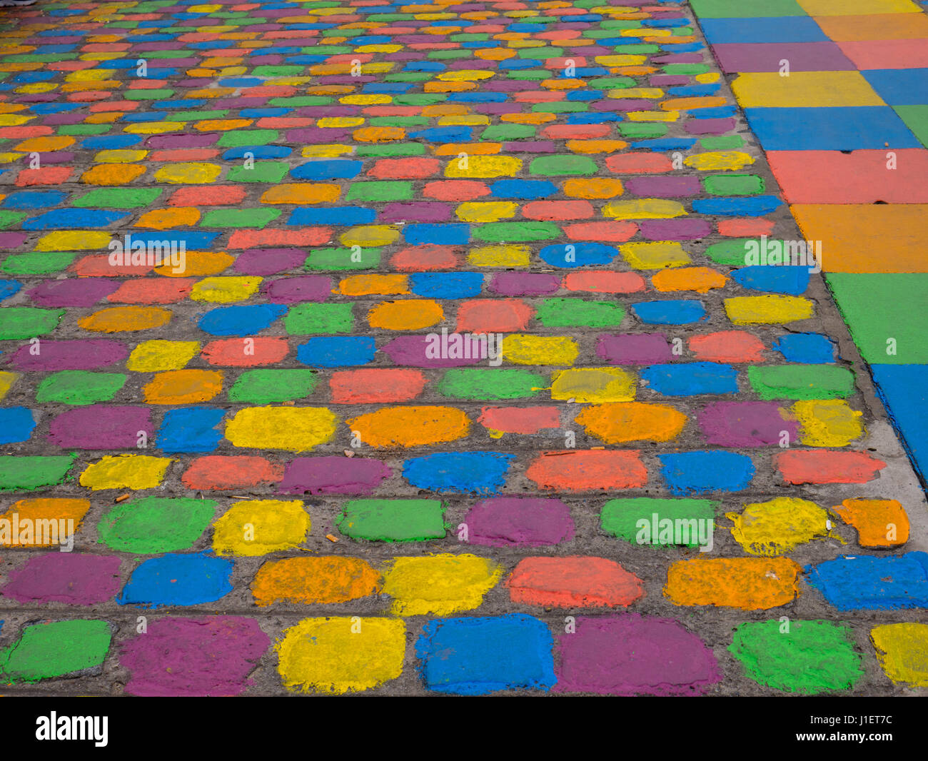 Colorful street in La Boca neighbourhood in Buenos Aires, Argentina. The street was painted in memory to the artist Benito Quinquela Martin Stock Photo