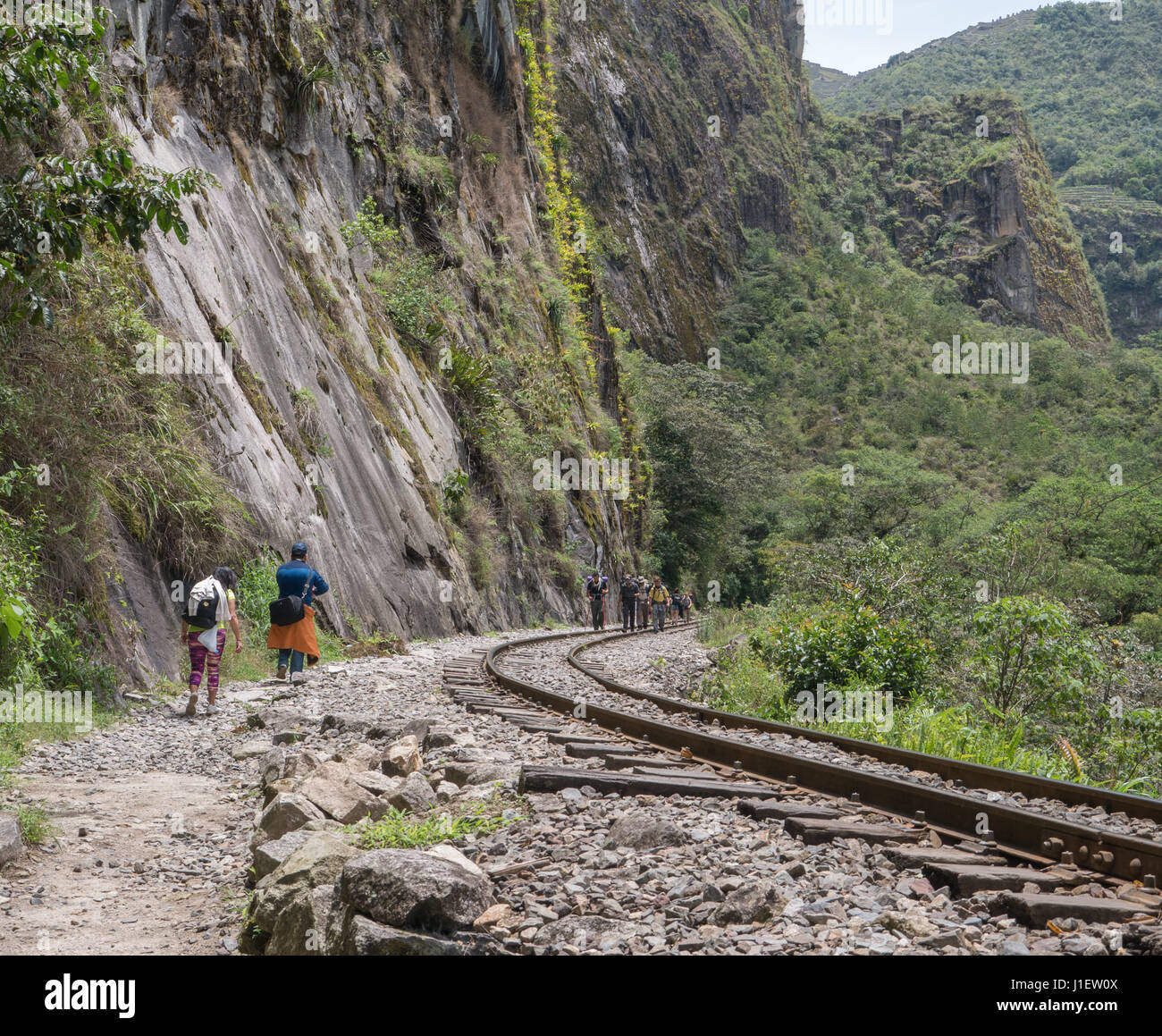 Travelers walking on Inca trail of Machu Picchu, Cusco Region, Urubamba Province, Machupicchu District, Peru Stock Photo