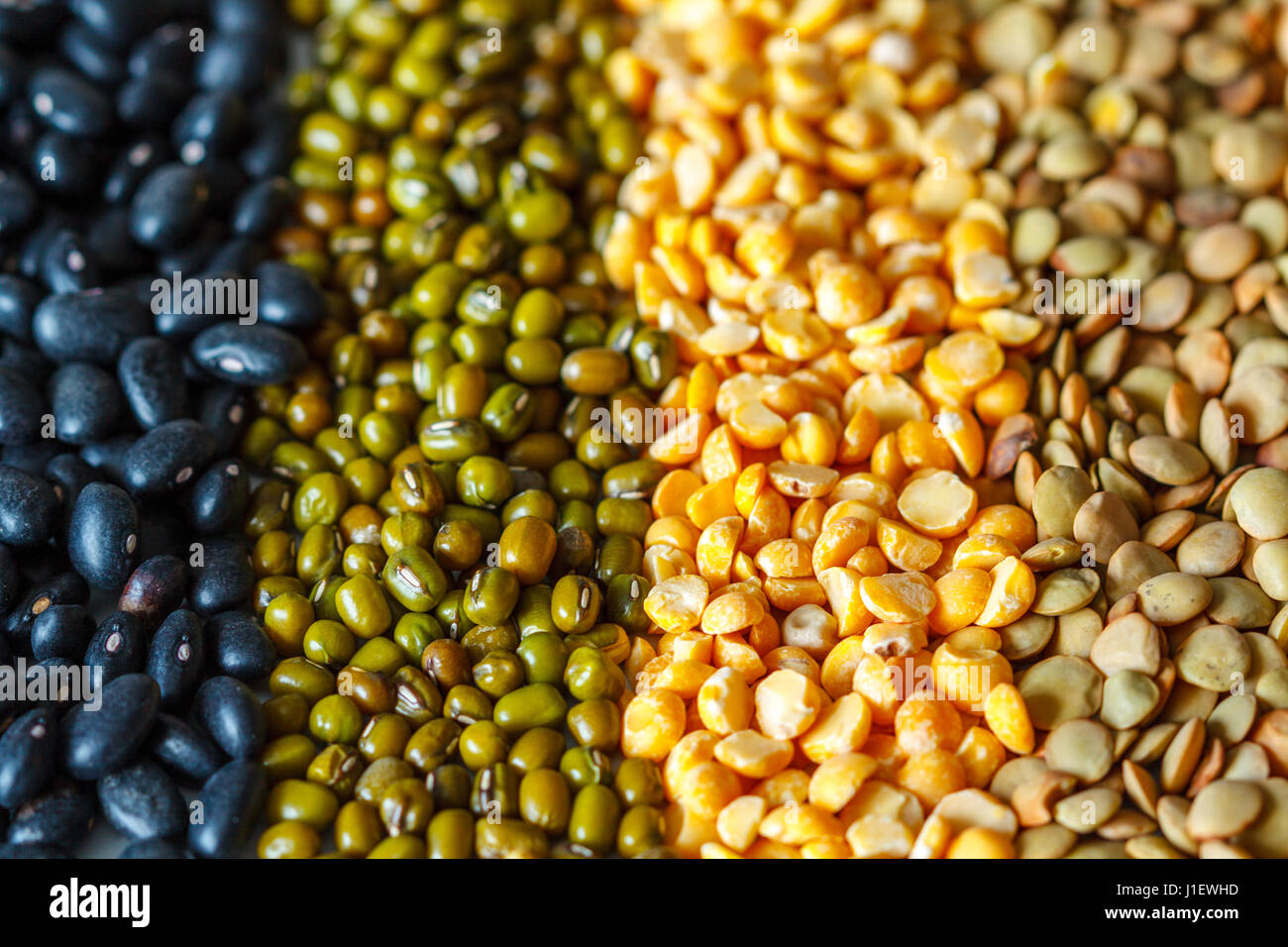 Cereals background: chickpeas, peas, lentils, black beans Stock Photo