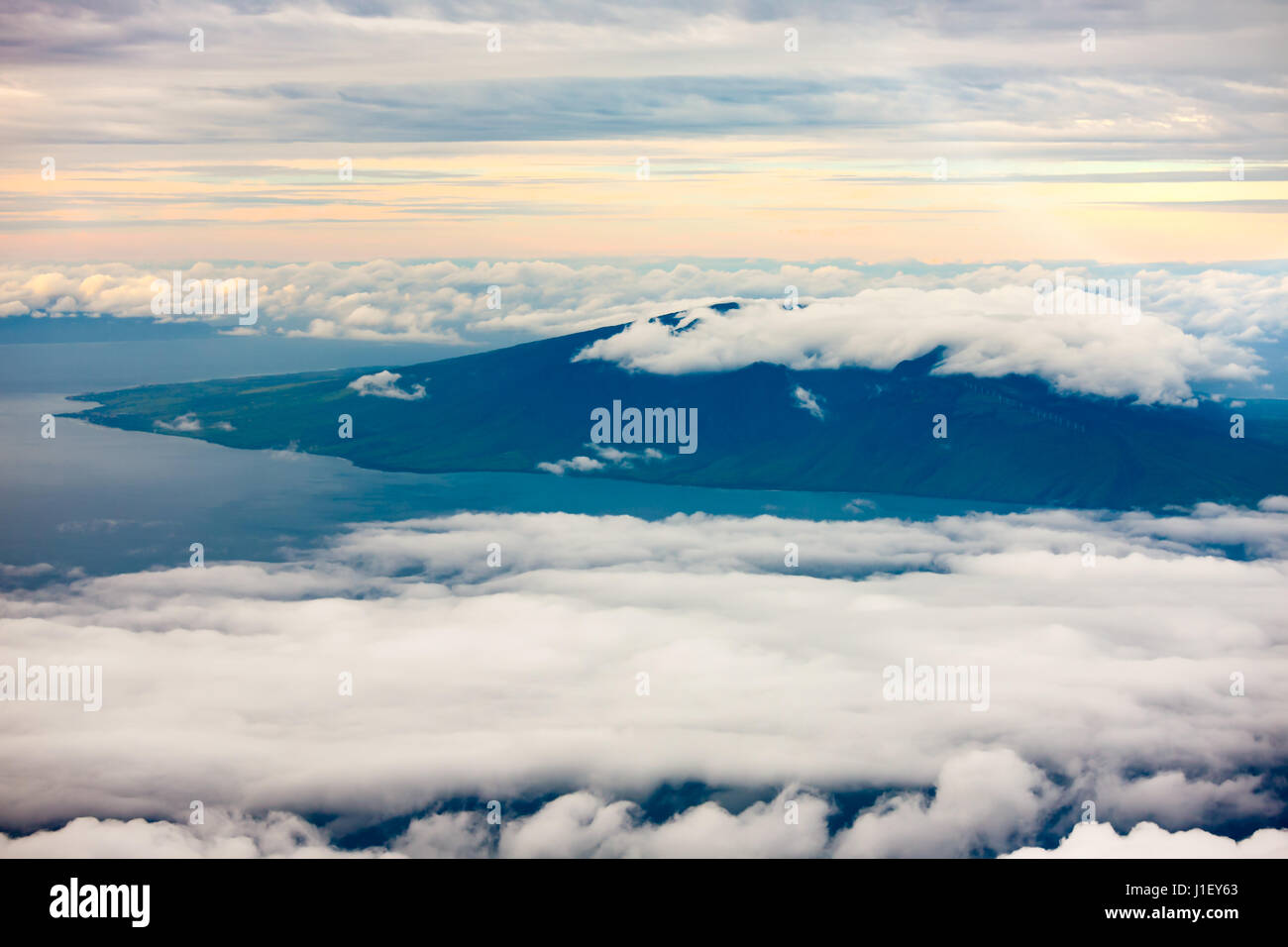 Aerial view of clouds surrounding a central Hawaiian island Stock Photo