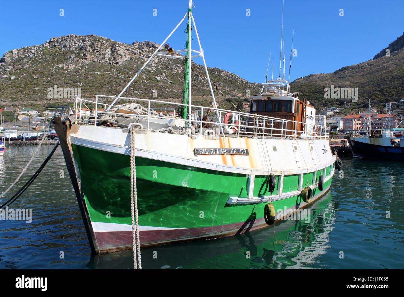 Fishing boats at Kalk Bay harbour, Cape Town, South Africa Stock Photo