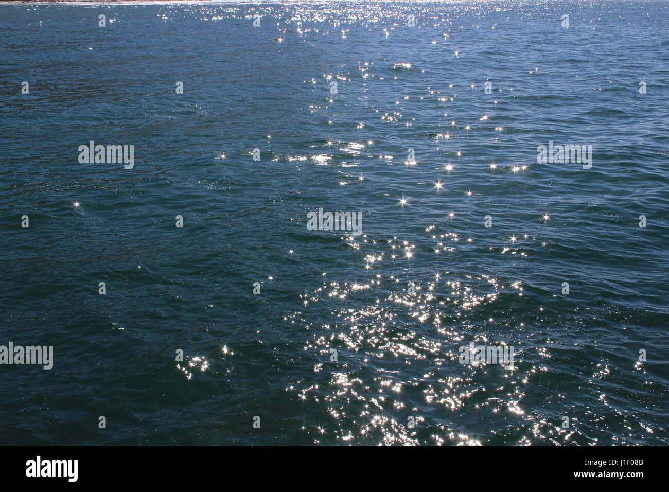 Sunlight on water, Kalk Bay harbour, Cape Town, South Africa Stock Photo