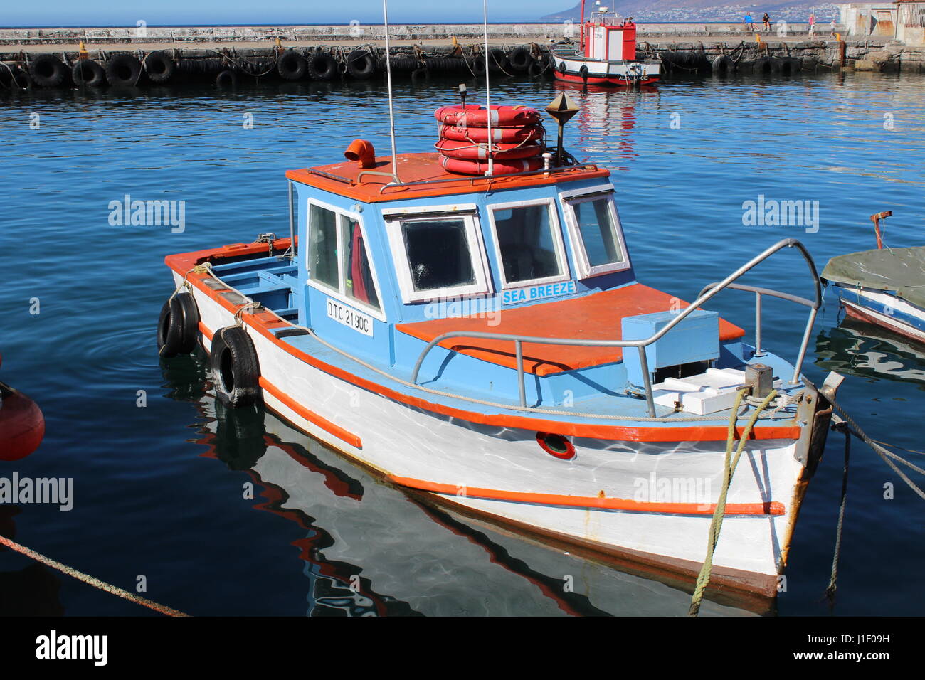 Fishing boats at Kalk Bay harbour, Cape Town, South Africa Stock Photo