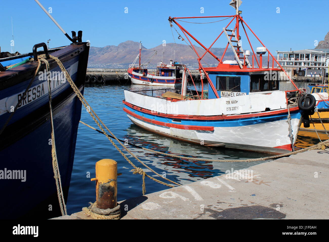 Fishing boats at Kalk Bay harbour, Cape Town, South Africa Stock Photo