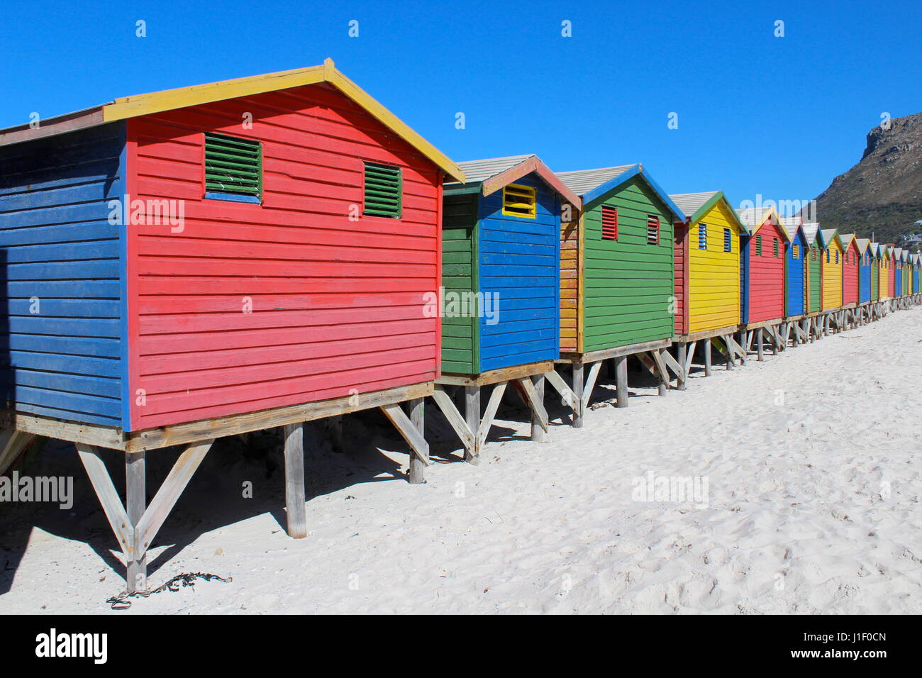 Colourful beach huts at Muizenberg beach, Cape Town, South Africa Stock Photo