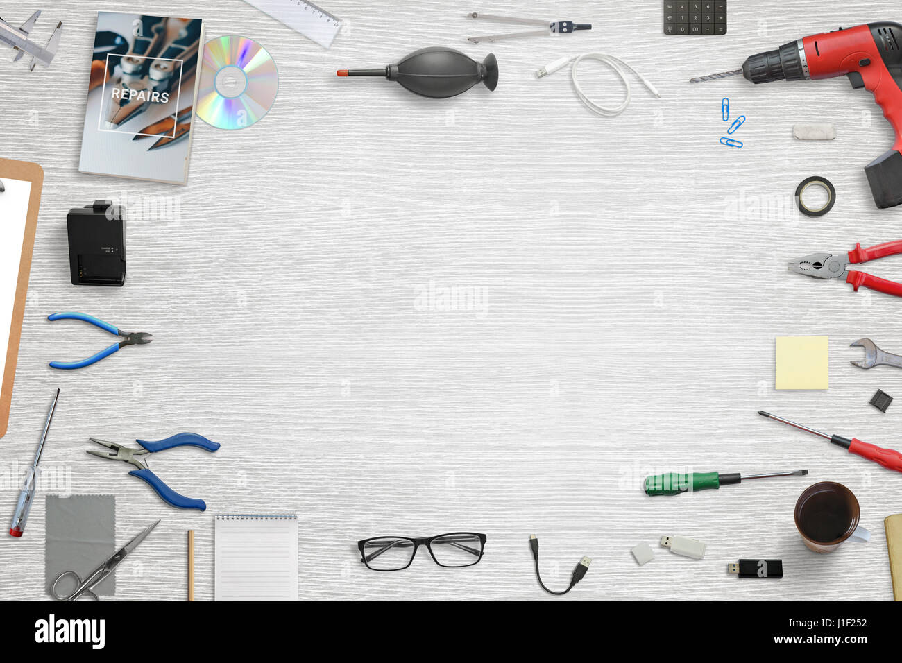Desk for fix, repair, maintenance electronic devices. Top view with free space for text. Tools beside. Stock Photo