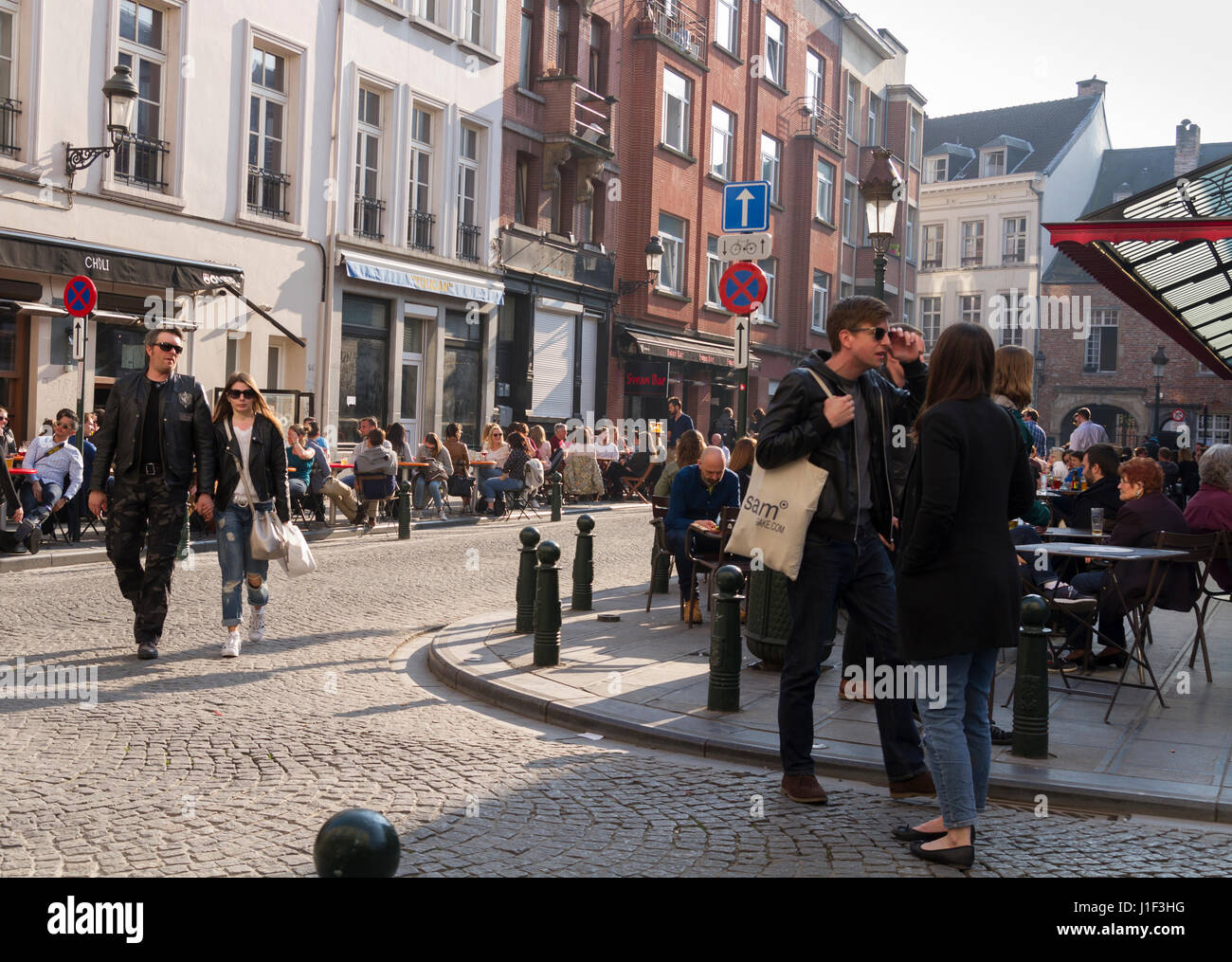 Bars and restaurants on Place Saint-Géry in Brussels, Belgium on a warm spring evening Stock Photo
