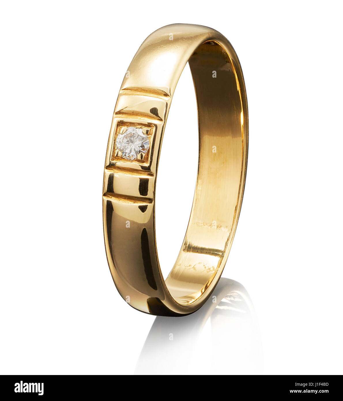 Golden ring with gemstone isolated on white background. Stock Photo
