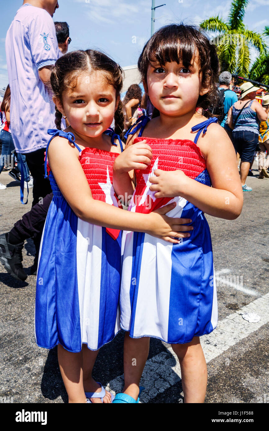 Miami Florida,Little Havana,Calle Ocho Carnaval Miami,annual street festival,carnival celebration,Hispanic girls,preschooler,hugging,costume,Puerto Ri Stock Photo