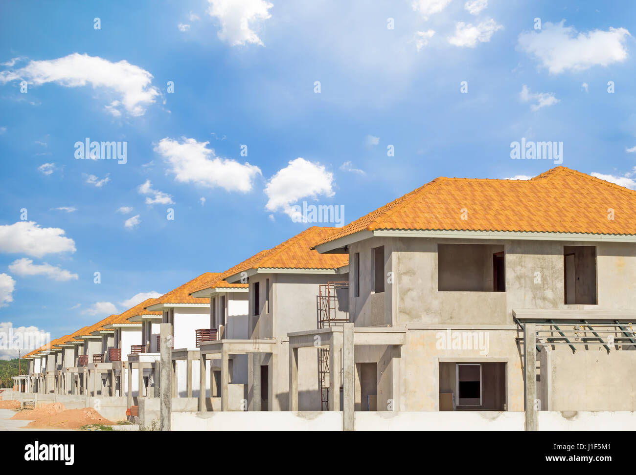 Exterior of town home building under construction with sky background. Stock Photo
