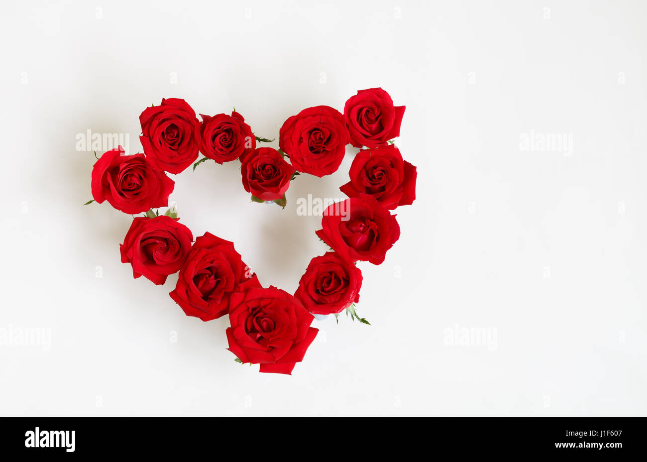 Heart Shaped Red Rose Arrangement on a White Background Stock Photo - Alamy