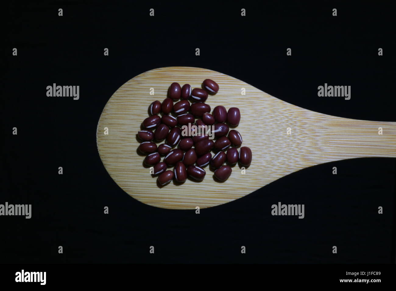 adzuki beans on wooden spoon Stock Photo